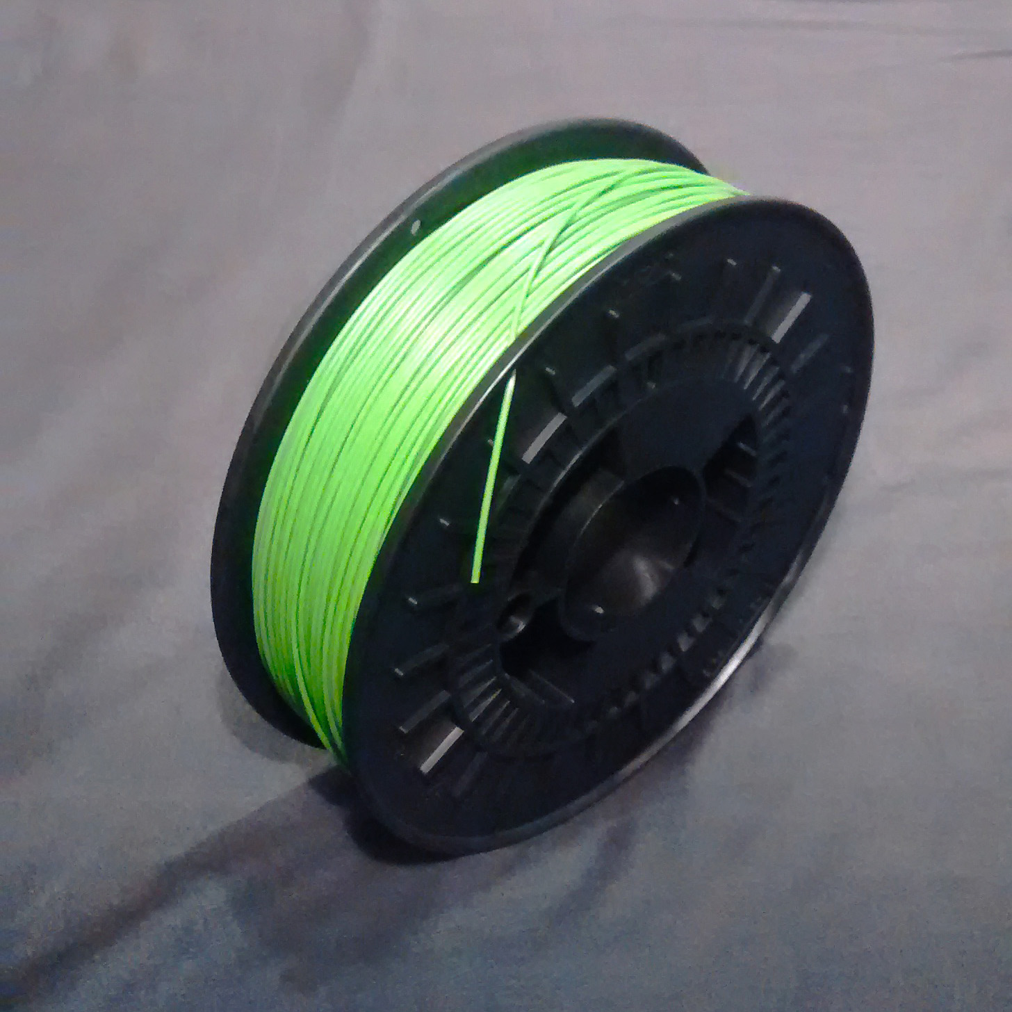 A spool wound with plastic filament for 3D printing