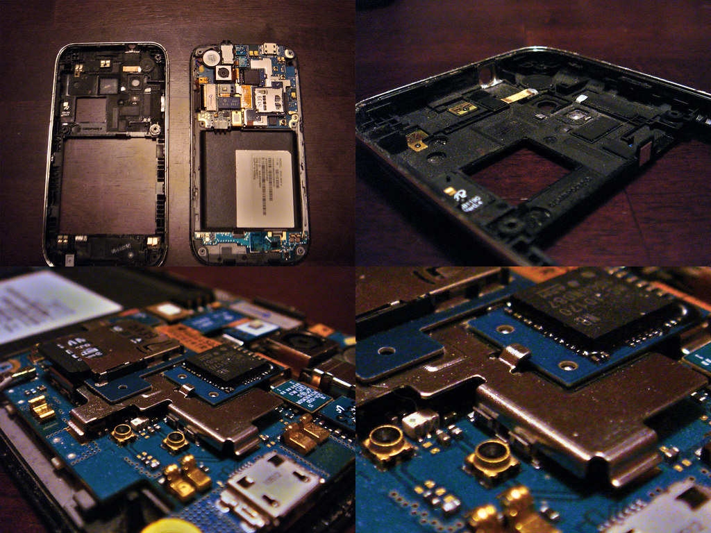 A disassembled smartphone: the back of the case removed and the board in close-up, with shielding cans over the chips and radio-frequency connectors.